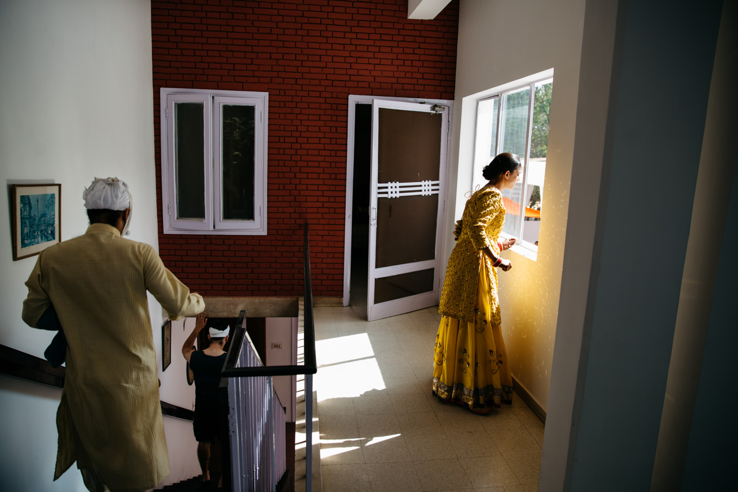 Women at yellow window — watching