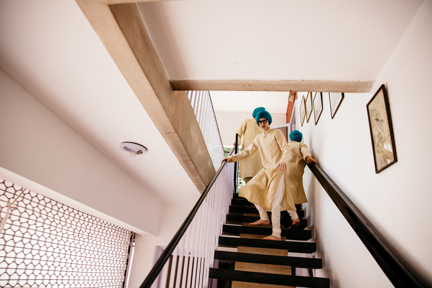 Men on stairs in blue turbans