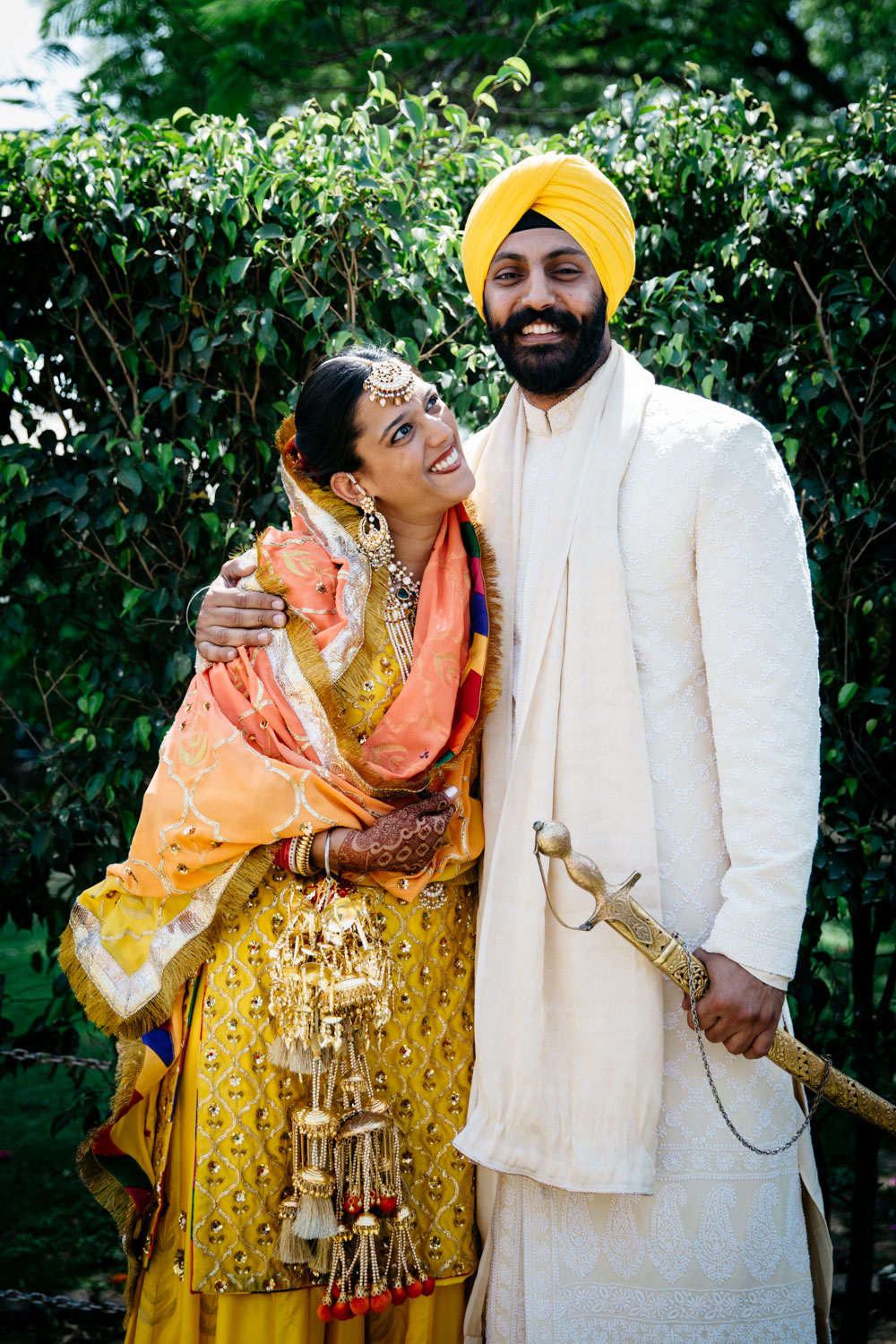 Formal couple portrait in garden — resolved